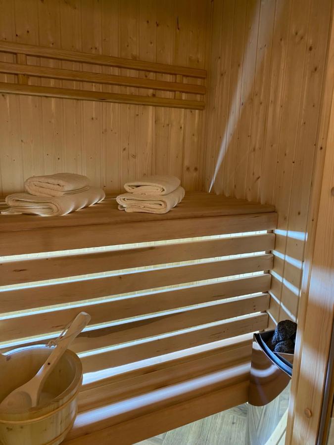 Family Sauna Apartments: Downtown Comfort With Private Wellness *